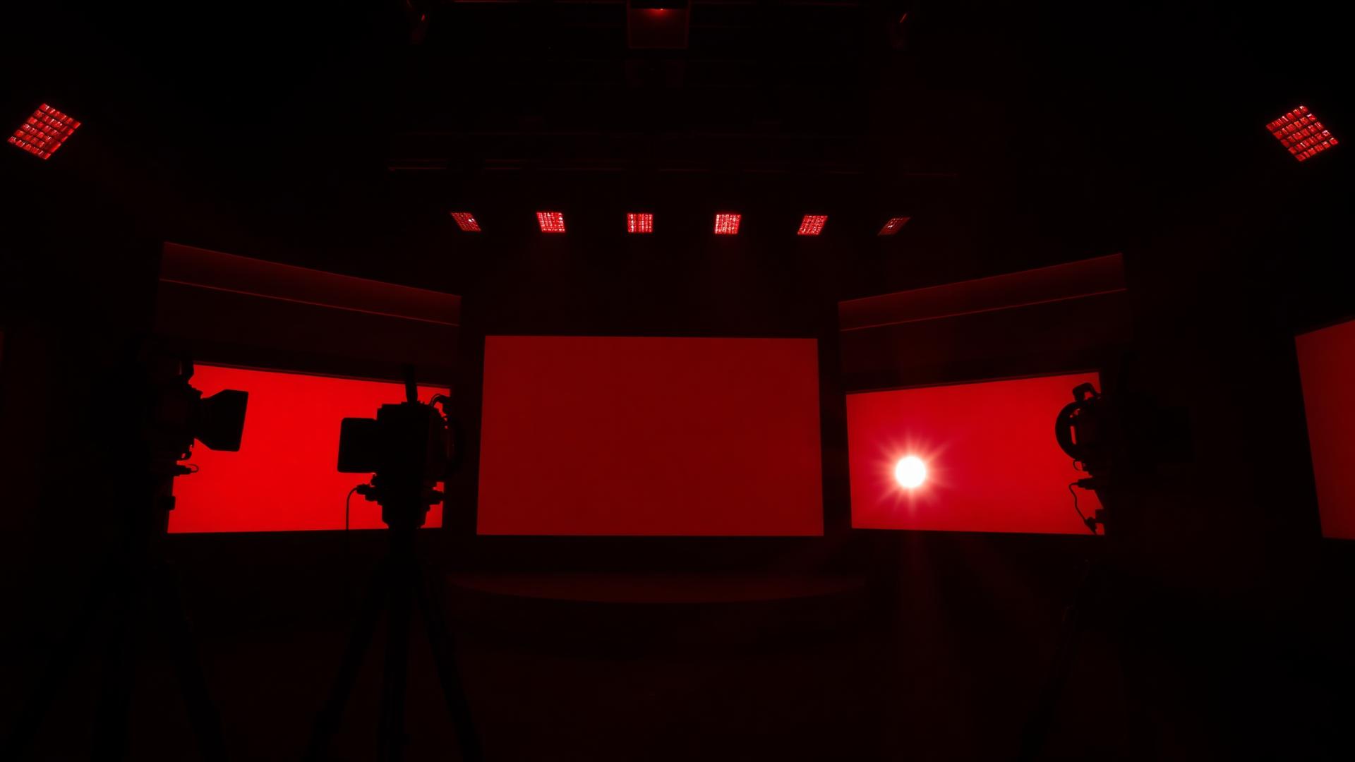 Entertainment DN TV broadcast studio with red stage lighting